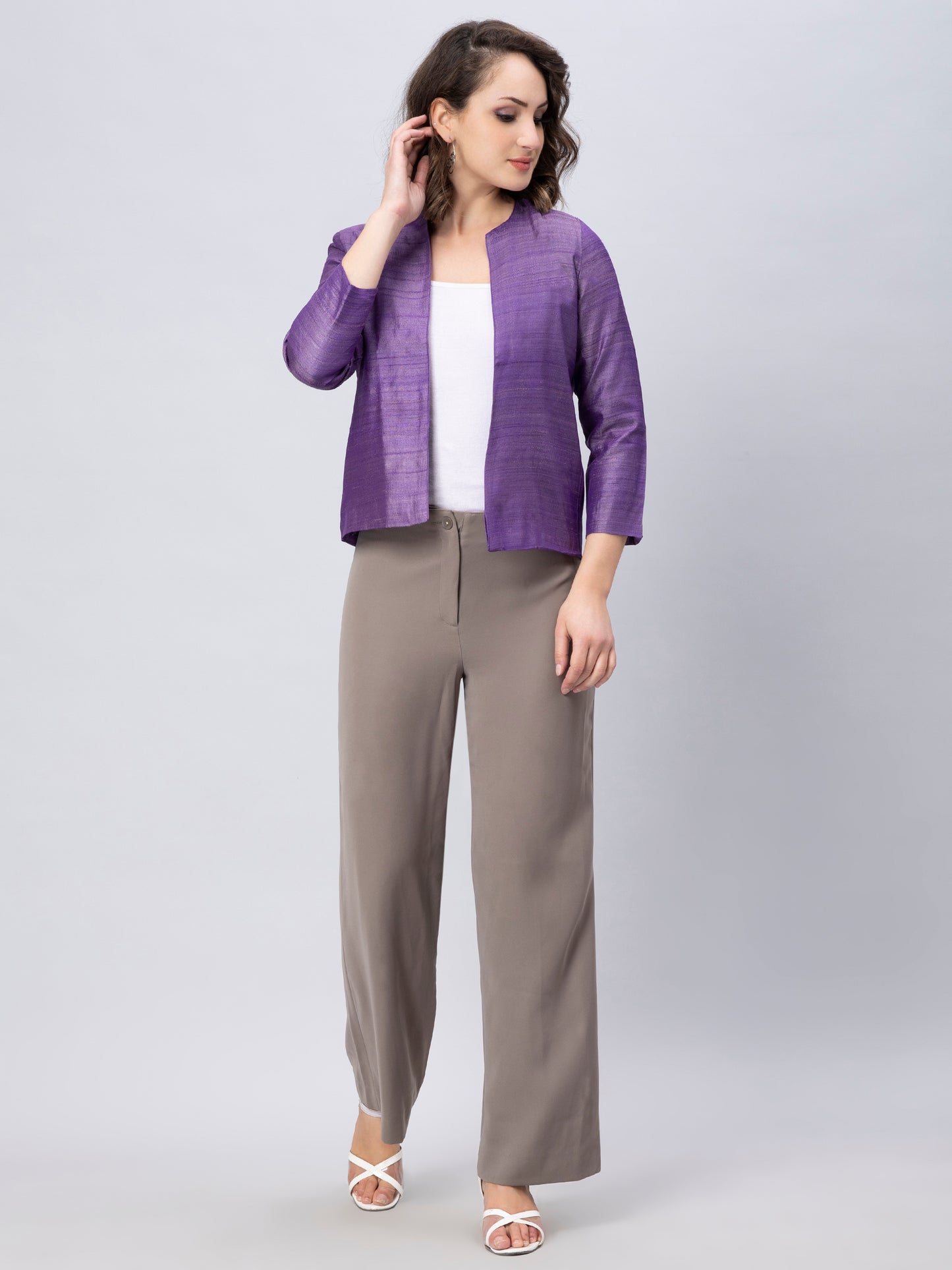 A Women in Purple Pure Tussar Blazer, womens workwear standing against a grey background