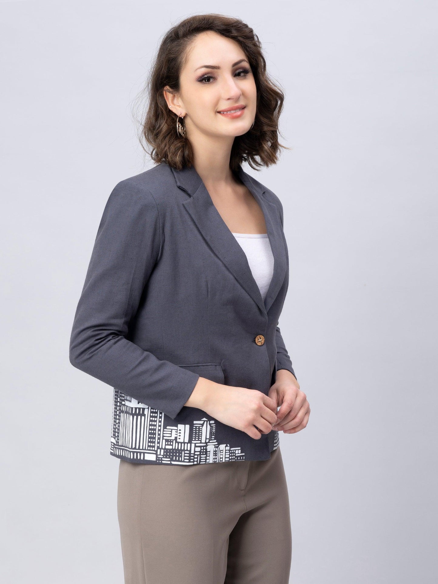 An aesthetic image of lady in Stylish Grey Blazer with Modern Motif, womens workwear