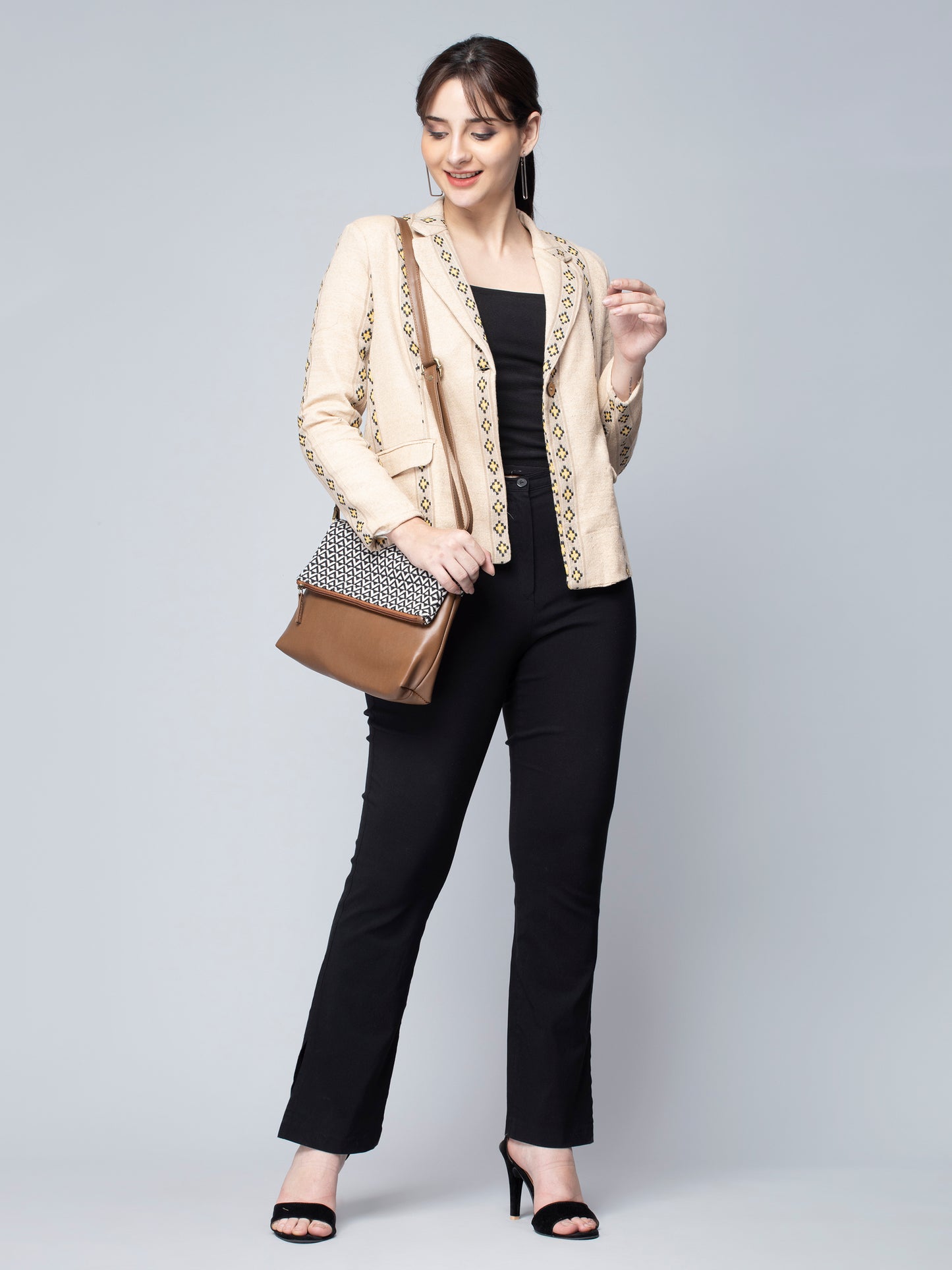 A pretty lady in Beige & Yellow Jute Blazer, a office wear for women with a handbag