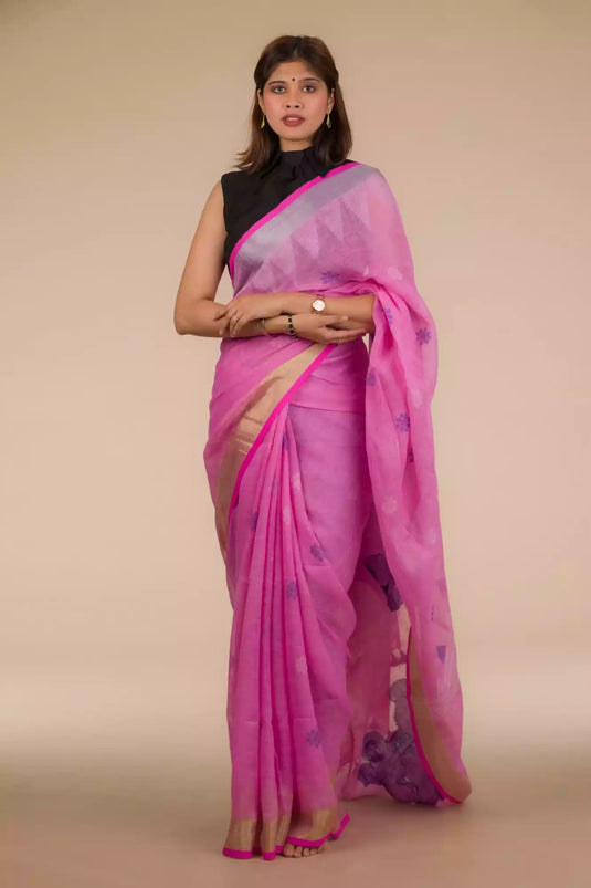 This a photo of beautiful woman wearing a Dark Pink Jamdani hand weaving In Pure Linen Saree, women workwears is posed in front of a tan background