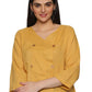 A model in Mustard Asymmetric Neck Side Button Top, a womens workwear is standing against a white background