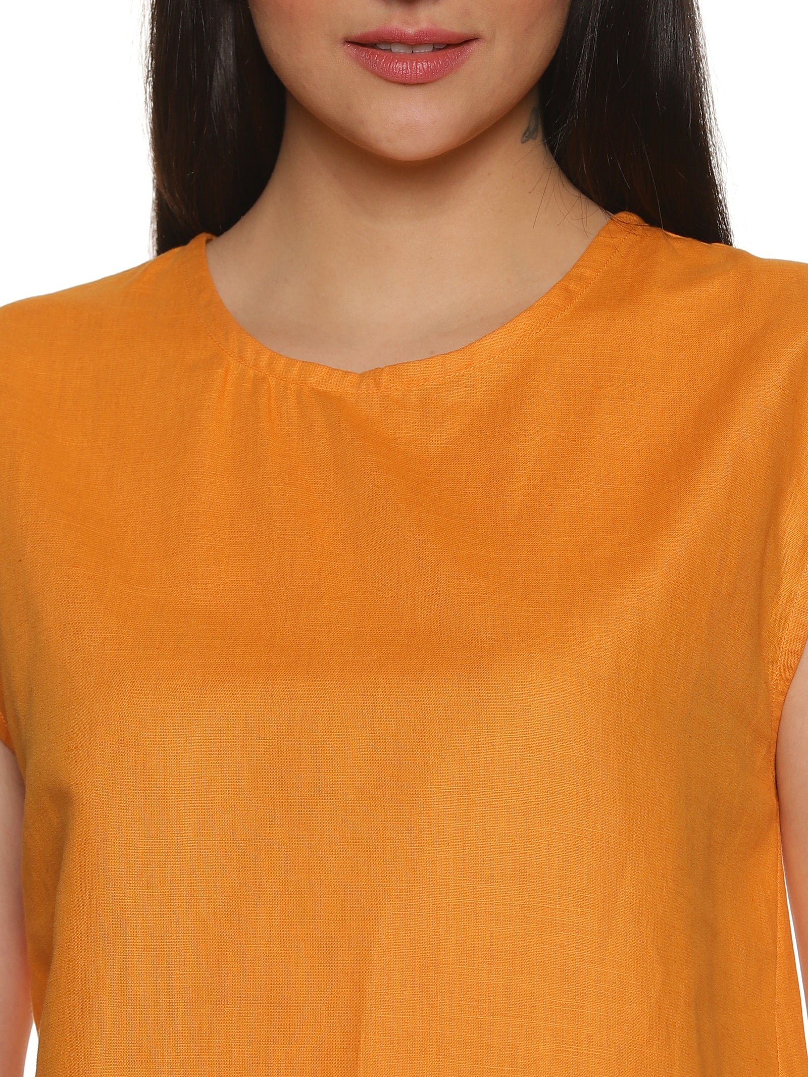 A zoomed in view of lady in Cotton Drop Shoulder orange Top, womens workwear 