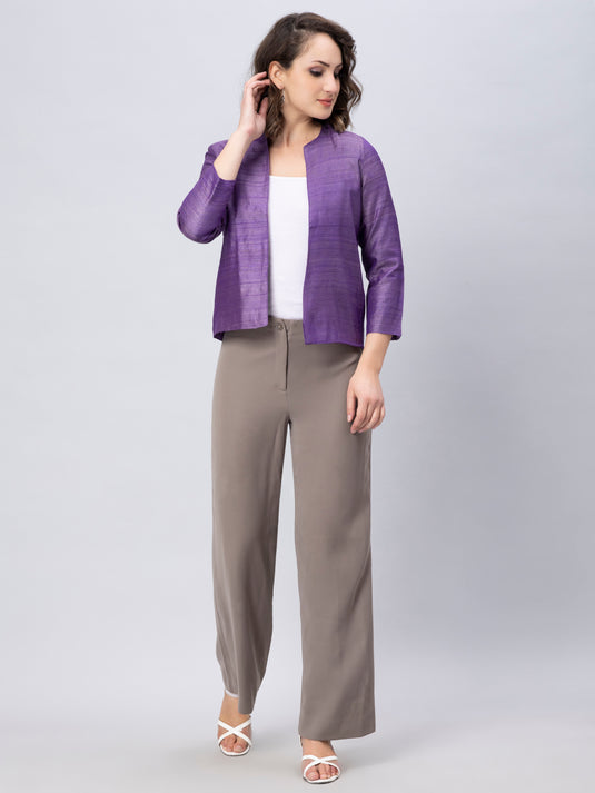 A Women in Purple Pure Tussar Blazer, womens workwear standing against a grey background 