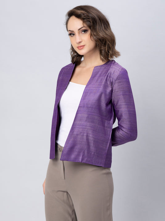 A lady in Purple Pure Tussar Blazer, womens workwear standing against a tan background