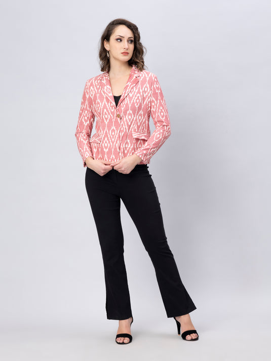 A Women in Pink Woven Ikkat Blazer In Pure Cotton, womens workwear standing against a grey background