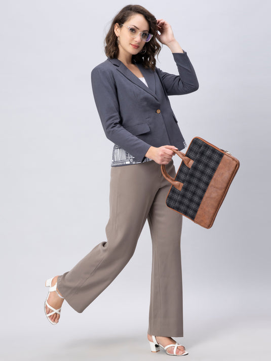A gorgeous picture of lady in Stylish Grey Blazer with Modern Motif womens workwear holding a bag