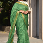 A gorgeous women in Myrtle Linen Saree in Olive Green, a office wear for women looking down
