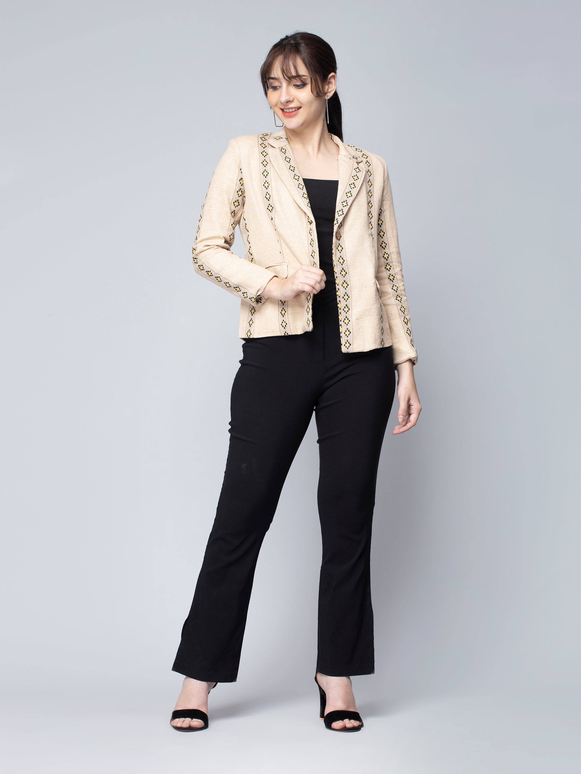 A picture of Beige & Yellow Jute Blazer, womens workwear standing against a grey background looking sideways
