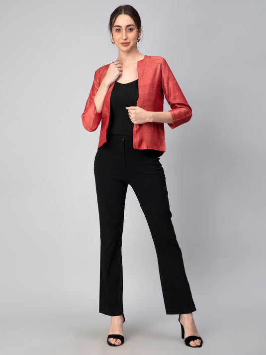 A Women in Earthy RED Pure Tussar Blazer, womens workwear standing against a grey background 