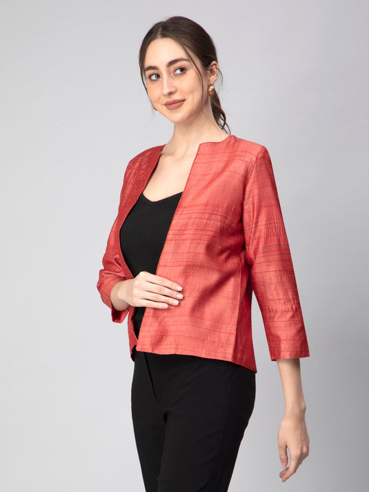 A lady in Earthy RED Pure Tussar Blazer, womens workwear standing against a tan background
