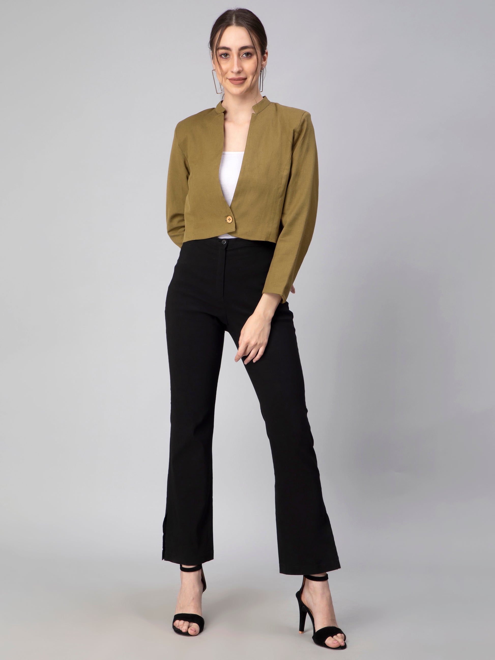A picture of Green Blazer In Pure Cotton, womens workwear standing against a grey background looking sideways