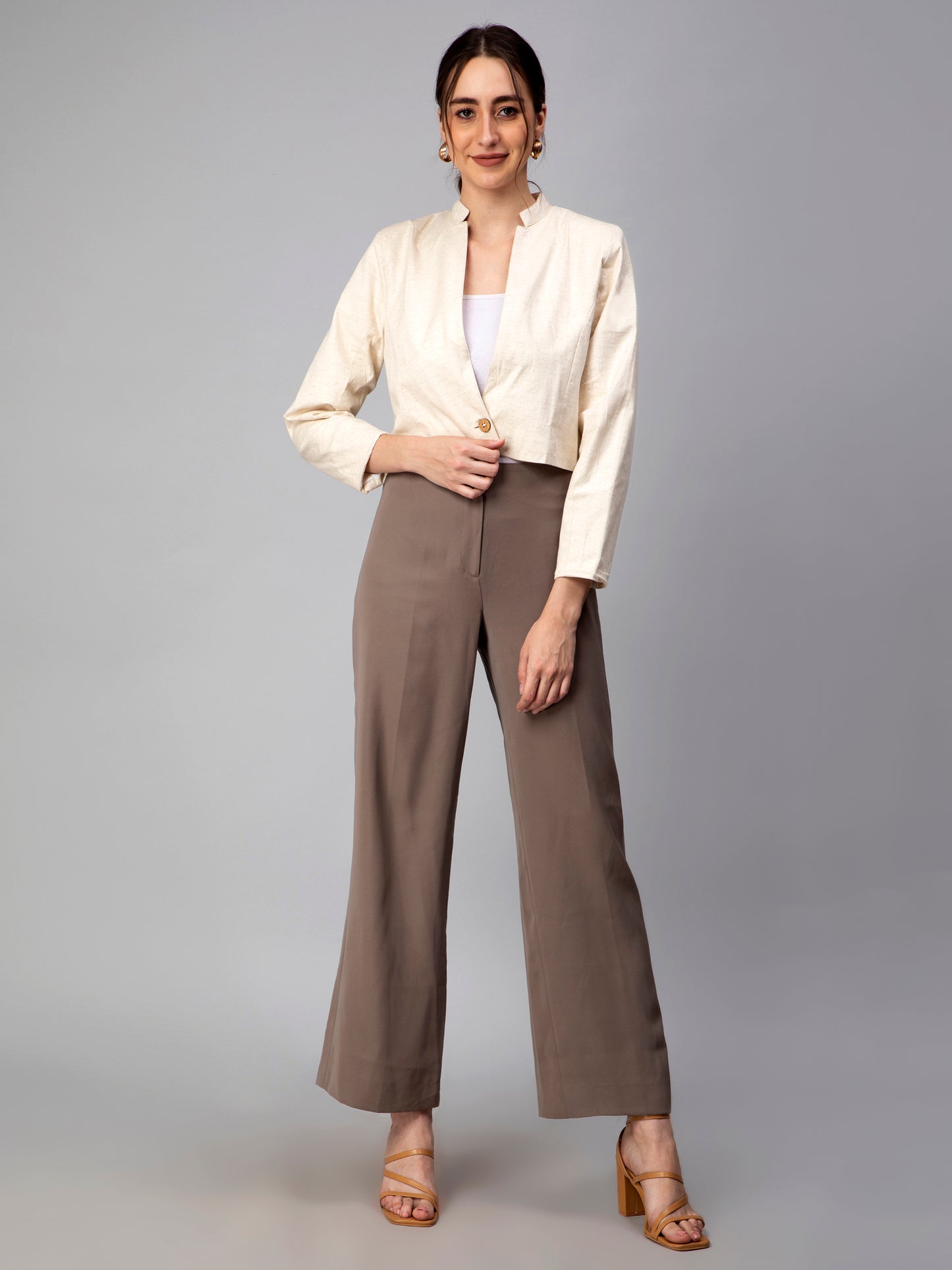 A picture of Beige Blazer In Pure Cotton, womens workwear standing against a grey background looking right into the camera