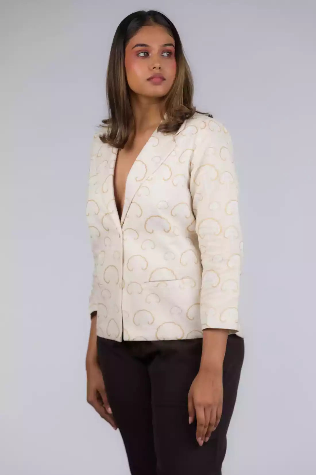 A picture of White Gold Tree Blazer In Pure Cotton, womens workwear standing against a grey background looking sideways