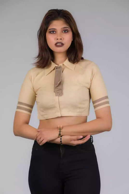 A lady in Light Beige Blouse with removeable Brown tie In Pure Cotton, womens workwear standing against a grey background looking sideways