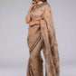 A zoomed out view of lady in Handwoven Soft Linen Cotton Saree in Beige and Black, womens workwear