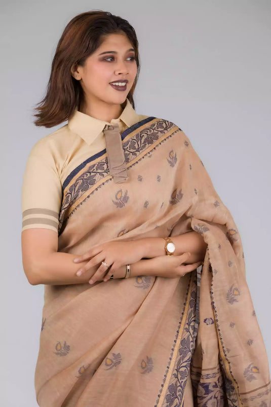 An aesthetic image of lady in Handwoven Soft Linen Cotton Saree in Beige and Black, womens workwear looking sideways