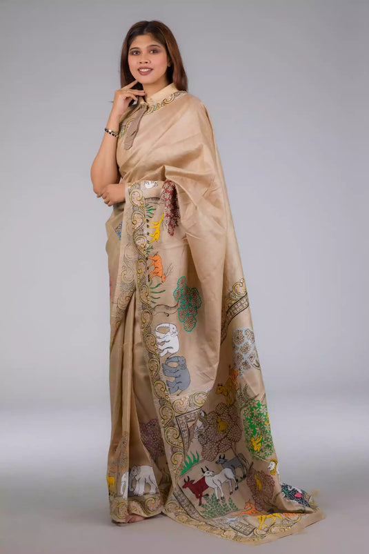  A beautiful zoomed out view of lady in Pure Tussar in Beige Saree adorned with Patachitra, womens workwear