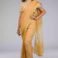 side look of a beautiful woman with short hair wearing beige saree with collared blouse