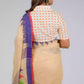 back look of a beautiful woman posing in beige saree with collared blouse and multicolor borders at both ends of the saree