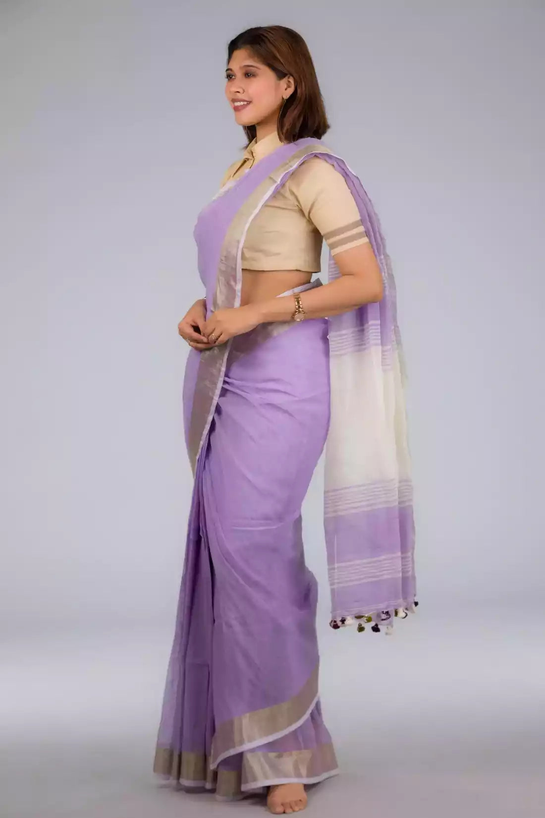A picture of Lilac Blush Linen Saree, womens workwear standing against a grey background  