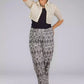 A Women inGrey Woven Ikkat bottom In Pure Cotton, womens workwear standing against a grey background