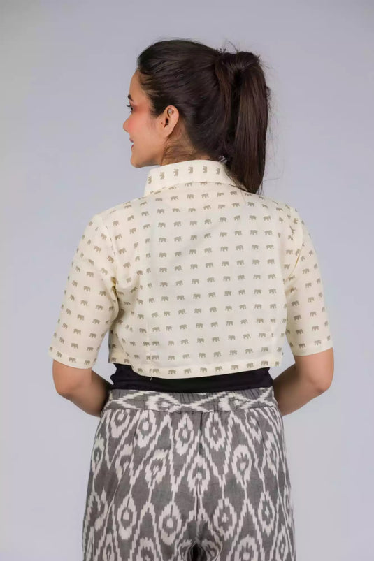 A beautiful back view of picture of Elephant Print Mul Cotton Blouse, womens workwear standing against a grey background looking sideways
