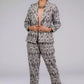 A lady in Grey Woven Ikkat bottom In Pure Cotton, womens workwear standing against a grey background