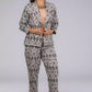 A picture of Grey Woven Ikkat bottom In Pure Cotton, womens workwear standing against a grey background looking sideways