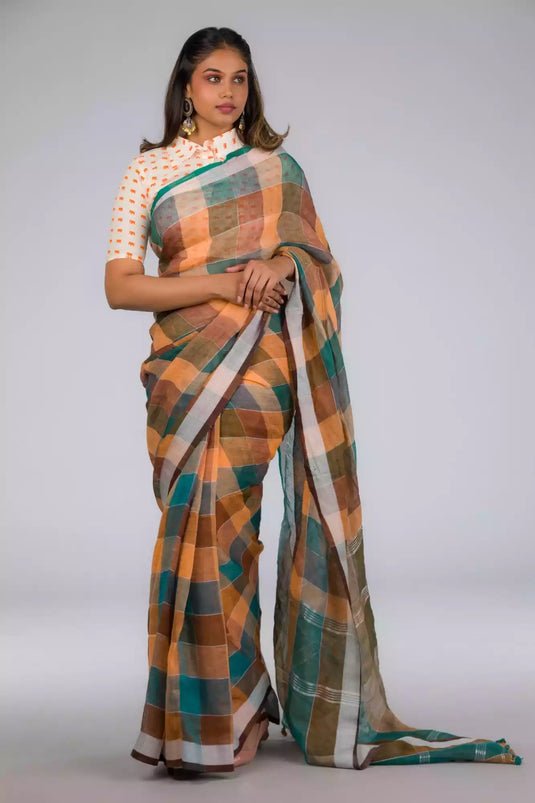 An aesthetic image of lady in Earthy Brown & Peacock Green Checkered Linen Saree, womens workwear 