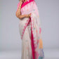 A gorgeous women in Fuchsia Pink & Dovetail White Jamdani Work Saree, a office wear for women looking to her right side
