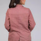 A beautiful back view of picture of Chevron Red Blazer In Pure Cotton, womens workwear standing against a grey background looking sideways