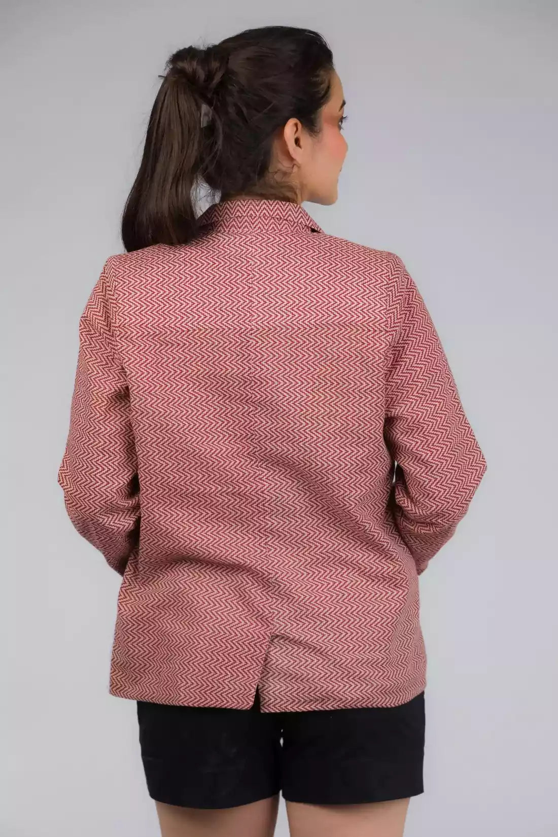 A beautiful back view of picture of Chevron Red Blazer In Pure Cotton, womens workwear standing against a grey background looking sideways
