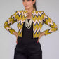 A picture of Green Chevron Blazer In Pure Cotton, womens workwear standing against a grey background looking sideways
