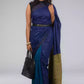 A model in Hues of Space Blue and Cobalt Blue Linen Woven Saree with Patli Pallu a womens workwear is standing against a grey background