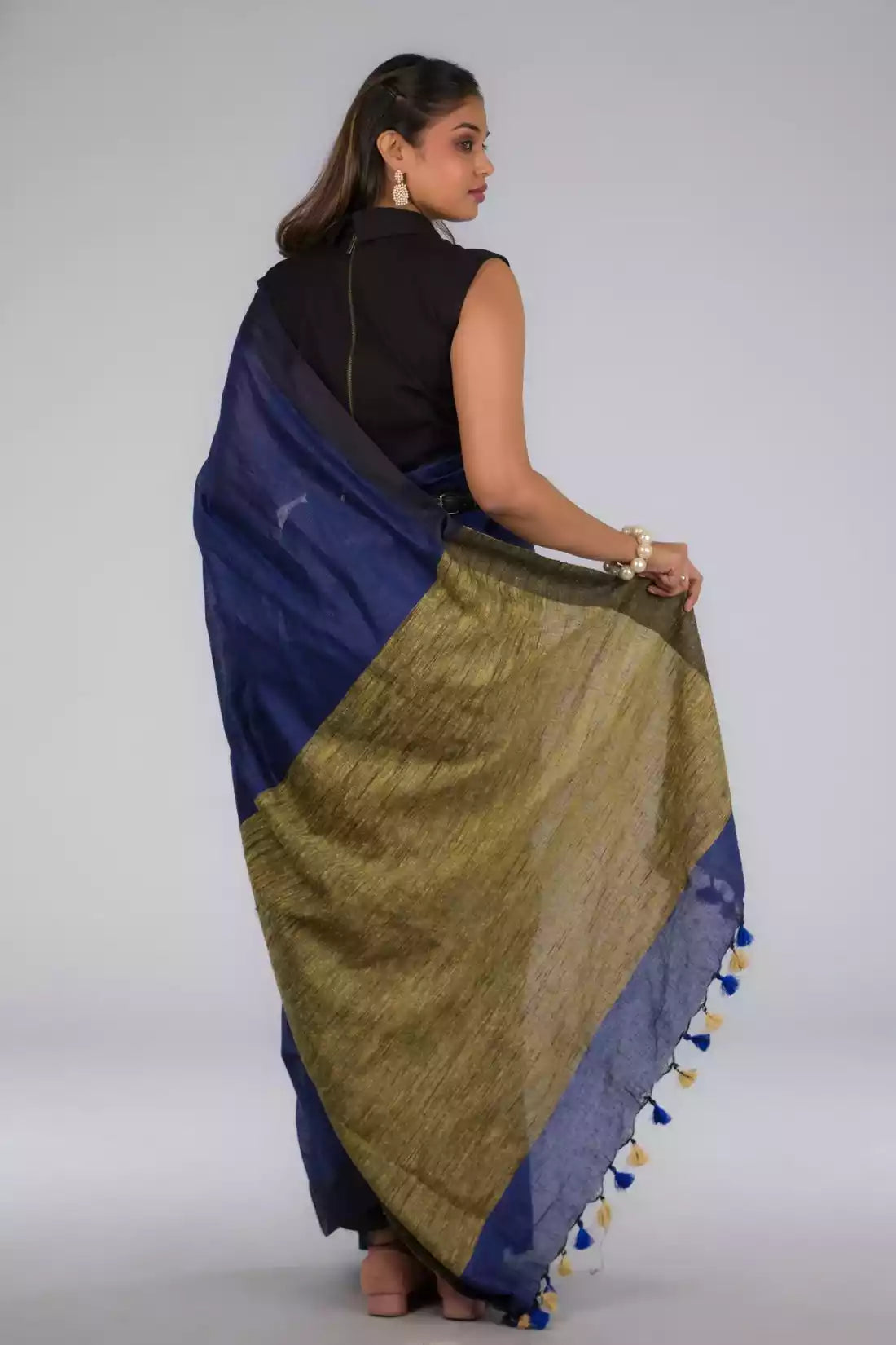 A beautiful back view of lady in Hues of Space Blue and Cobalt Blue Linen Woven Saree with Patli Pallu, womens workwear