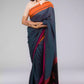 a woman looking sideways wearing formal workwear Grey - Orange &pink border with black jamdani pallu In Pure Cotton Saree