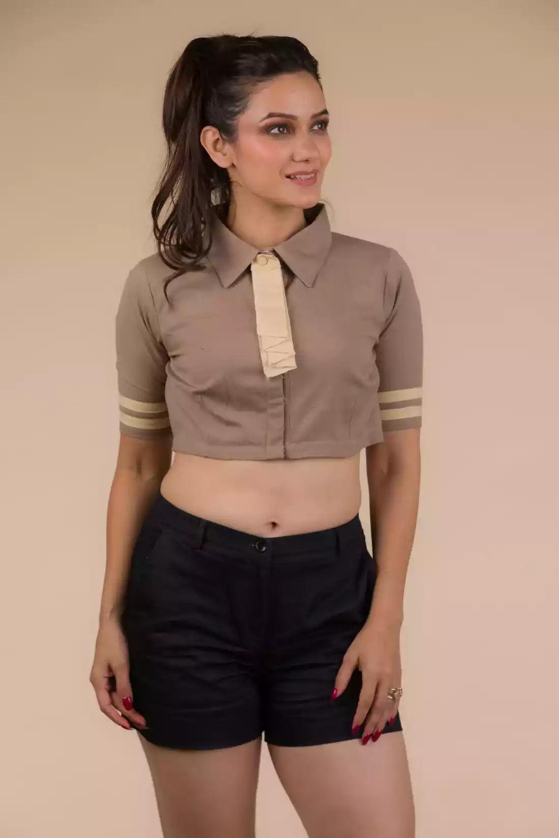 A Women in Beauty in Beige Cotton Tie Blouse in Light Brown (Removable Tie), womens workwear standing against a beige background looking sideways