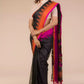 a woman looking sideways wearing formal workwear Black with Orange and pink border Jamdani hand weaving Saree In Pure Cotton Saree