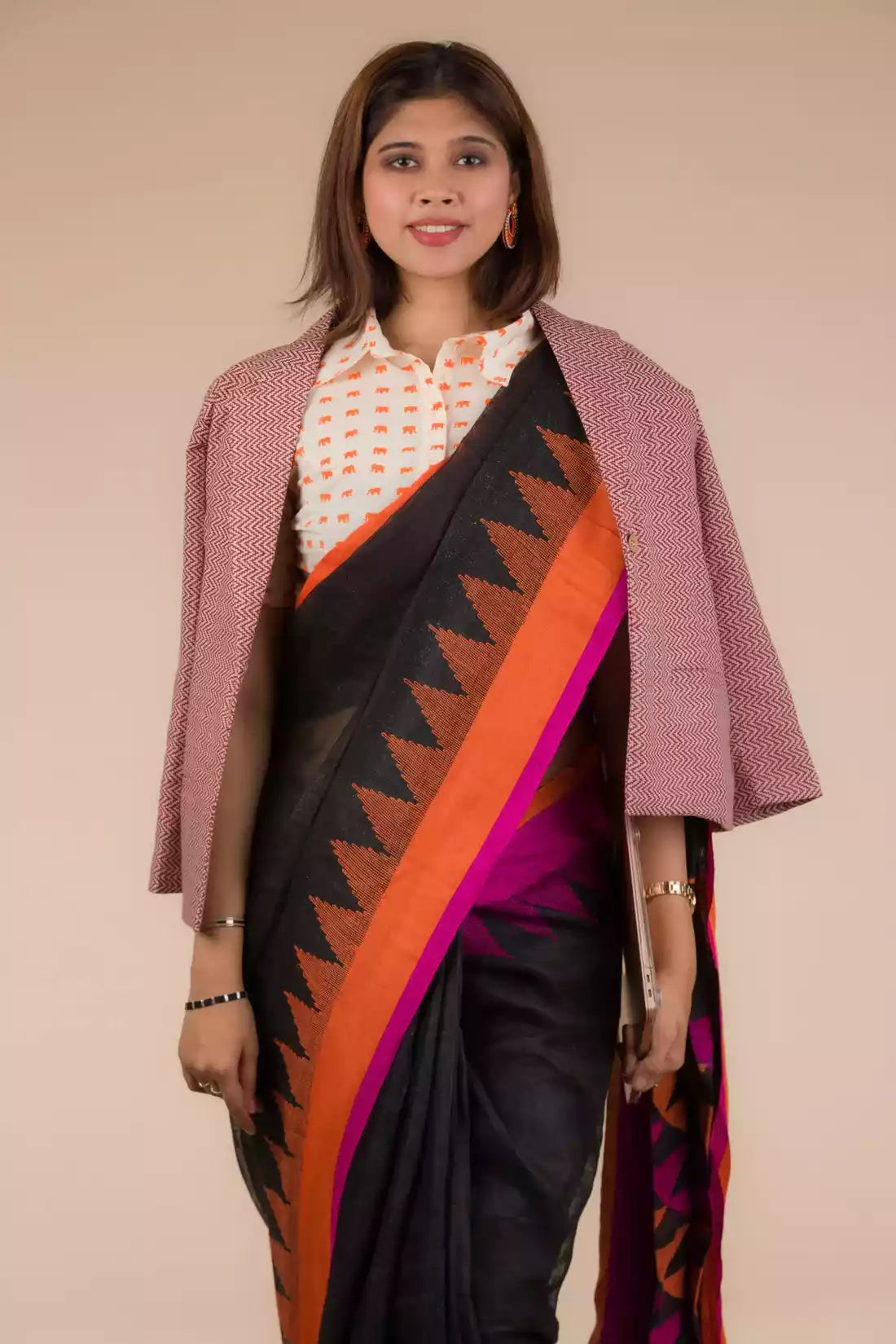 This the portrait of lady in Black with Orange and pink border Jamdani hand weaving Saree with formal blazer for women
