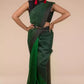 A model in Pure Linen Saree in Dual Shades of Green a womens workwear is standing against a beige background