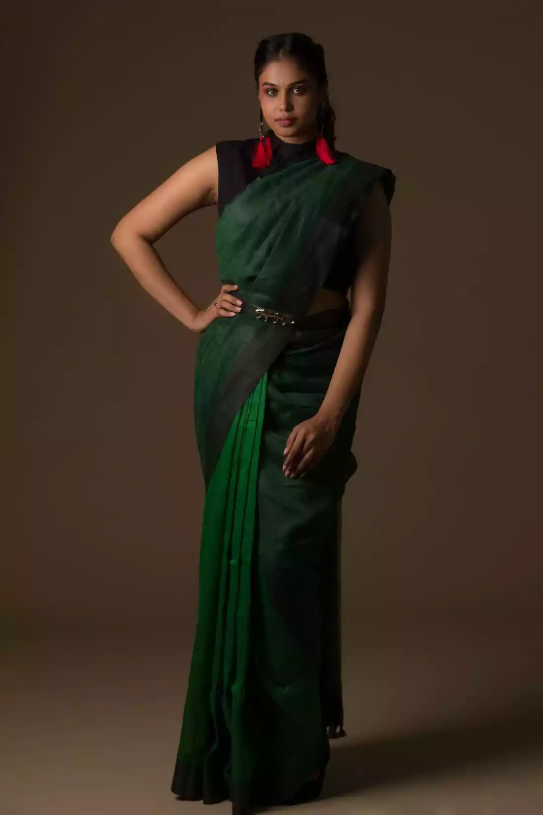 A zoomed out view of women wearing a Pure Linen Saree in Dual Shades of Green, formal dress for women