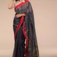a woman looking sideways wearing formal workwear Grey and Pink border Pure Cotton Saree