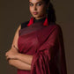 A zoomed out view of women wearing a Earthy Brown Pure Linen Saree with Maroon Pleats and Anchal, formal dress for women