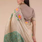 A beautiful back view of lady in Hand-painted Patachitra Lotus & Peacock design Pure Tussar Saree in Beige, womens workwear
