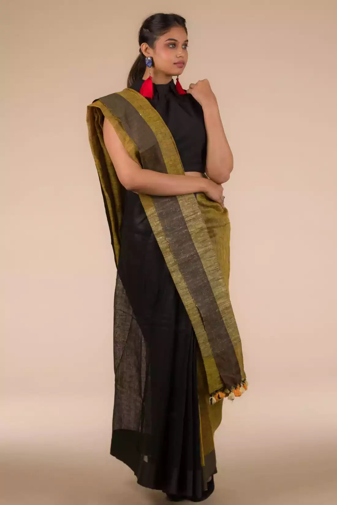 An aesthetic image of lady in Black Pure Linen Saree with Tints of Mustard, womens workwear 