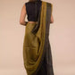 A beautiful back view of lady in Black Pure Linen Saree with Tints of Mustard, womens workwear