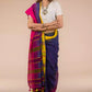 a woman in Blue and Pink & Yellow Pallu & Designs In Pure Cotton Saree, a business formal for women standing in front of a beige backdrop