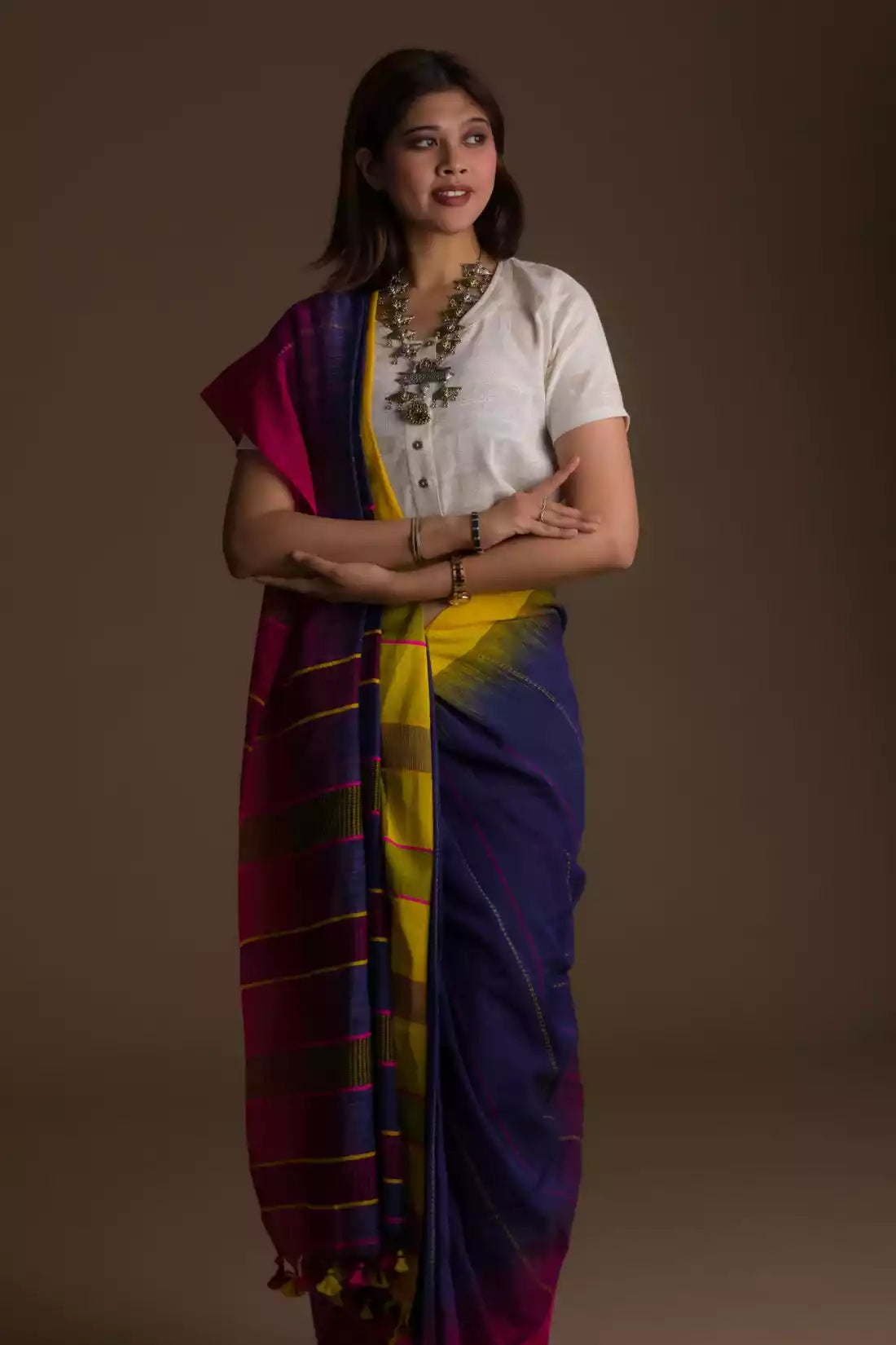 The woman in picture is wearing workwear for woman saree