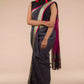 An aesthetic image of lady in Refined Dusk Linen Saree in Steel-Grey, womens workwear looking sideways