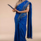 An aesthetic image of lady in Indy Pure Linen Saree in Royal Blue, womens workwear looking sinto the file